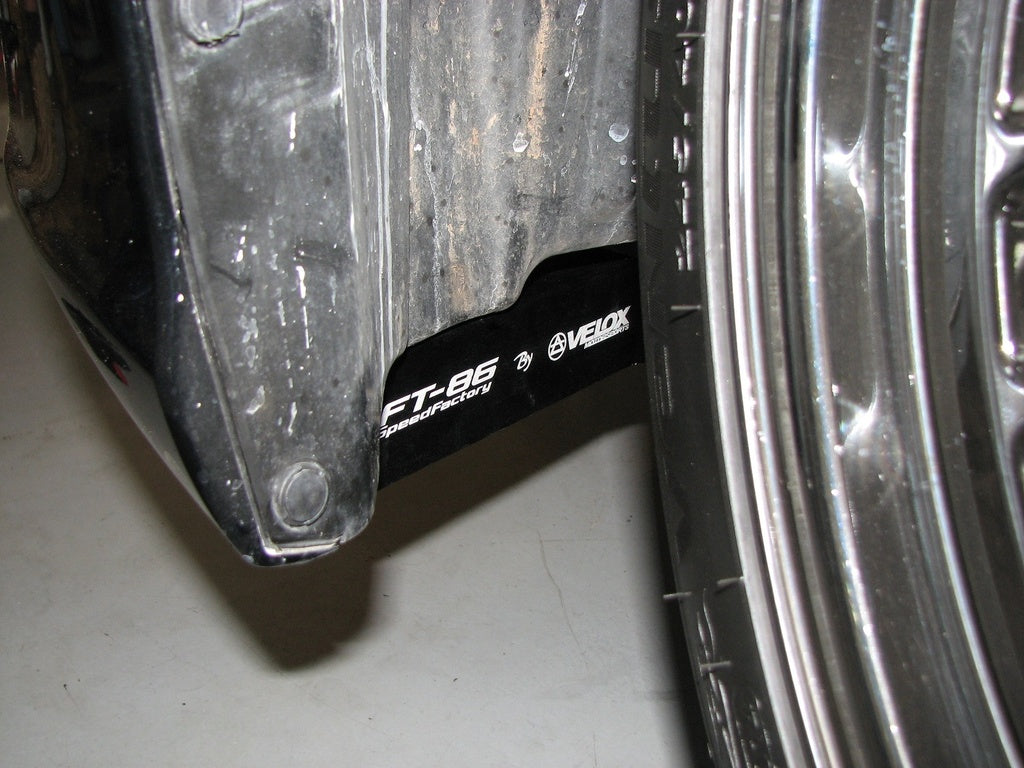 Front wheel deflector installed ahead of front tire